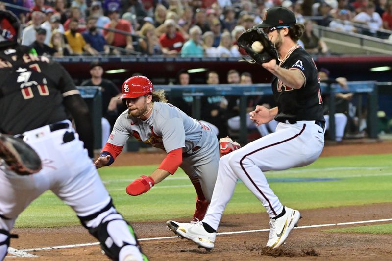 Jul 26, 2023; Phoenix, Arizona, USA;  St. Louis Cardinals second baseman Brendan Donovan (33) scores as Arizona Diamondbacks starting pitcher Zac Gallen (23) and catcher Jose Herrera (11) defend in the third inning at Chase Field. Mandatory Credit: Matt Kartozian-USA TODAY Sports