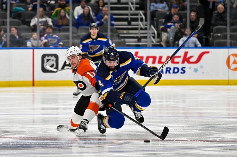 Jan 15, 2024; St. Louis, Missouri, USA;  Philadelphia Flyers right wing Travis Konecny (11) and St. Louis Blues defenseman Nick Leddy (4) battle for the puck during the second period at Enterprise Center. Mandatory Credit: Jeff Curry-USA TODAY Sports