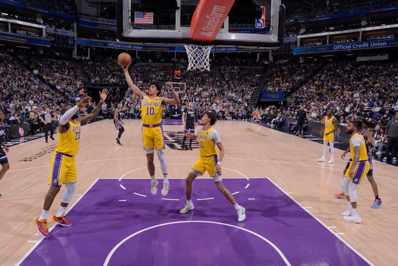 SACRAMENTO, CA - MARCH 13:  Max Christie #10 of the Los Angeles Lakers grabs a rebound during the game against the Sacramento Kings on March 13, 2024 at Golden 1 Center in Sacramento, California. NOTE TO USER: User expressly acknowledges and agrees that, by downloading and or using this Photograph, user is consenting to the terms and conditions of the Getty Images License Agreement. Mandatory Copyright Notice: Copyright 2024 NBAE (Photo by Rocky Widner/NBAE via Getty Images)