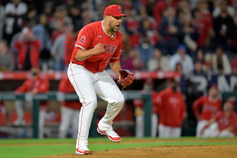 Apr 6, 2024; Anaheim, California, USA; Los Angeles Angels pitcher Carlos Estevez (53) celebrates after the final out of the ninth inning and a save against the Boston Red Sox at Angel Stadium. Mandatory Credit: Jayne Kamin-Oncea-USA TODAY Sports