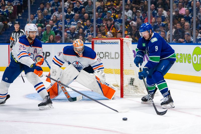 May 8, 2024; Vancouver, British Columbia, CAN; Edmonton Oilers defenseman Darnell Nurse (25) and goalie Stuart Skinner (74) watch as Vancouver Canucks forward J.T. Miller (9) redirects a shot past Skinner during the third period in game one of the second round of the 2024 Stanley Cup Playoffs at Rogers Arena. Mandatory Credit: Bob Frid-USA TODAY Sports