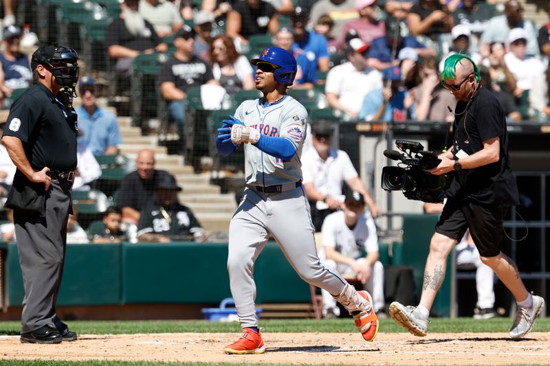 Sep 1, 2024; Chicago, Illinois, USA; New York Mets shortstop Francisco Lindor (12) crosses home plate after hitting a solo home run against the Chicago White Sox during the fourth inning at Guaranteed Rate Field. Mandatory Credit: Kamil Krzaczynski-USA TODAY Sports