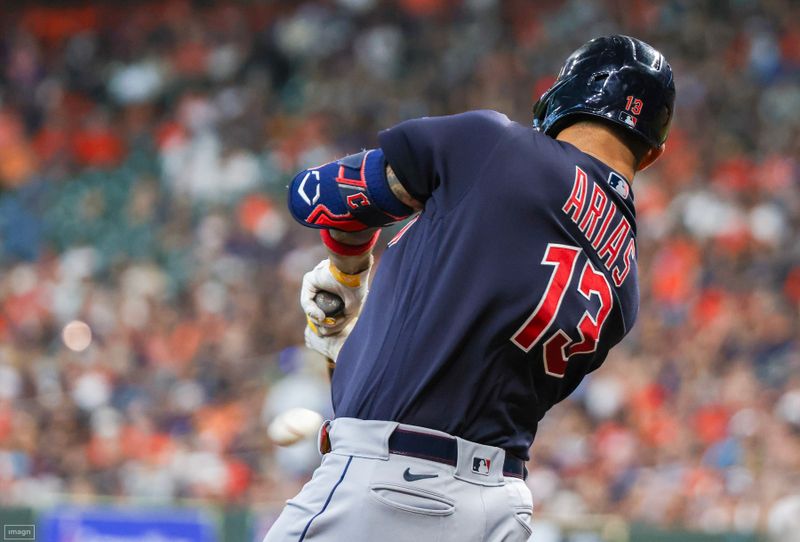 Aug 2, 2023; Houston, Texas, USA; Cleveland Guardians shortstop Gabriel Arias (13) drives in two runs against the Houston Astros in the second inning  at Minute Maid Park. Mandatory Credit: Thomas Shea-USA TODAY Sports