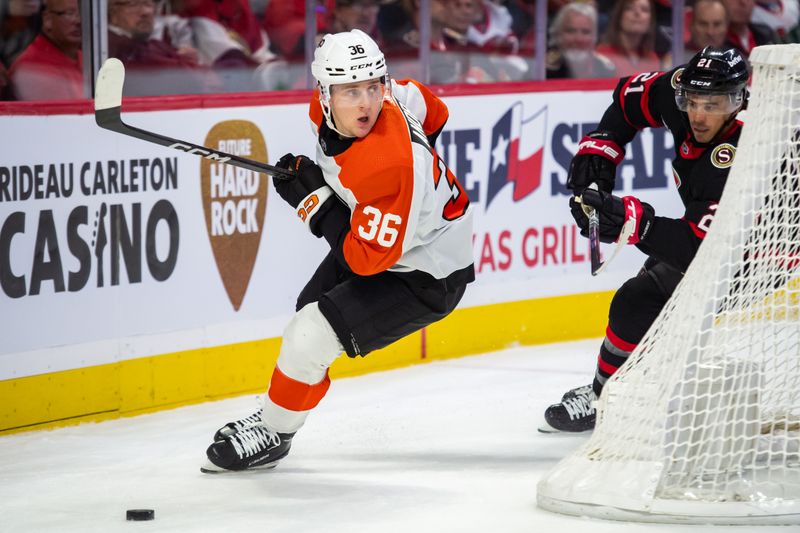 Oct 14, 2023; Ottawa, Ontario, CAN; Philadelphia Flyers defenseman Emil Andrae (36) moves the puck with Ottawa Senators right wing Mathieu Joseph (21) in pursuit during the first period at the Canadian Tire Centre. Mandatory Credit: Marc DesRosiers-USA TODAY Sports