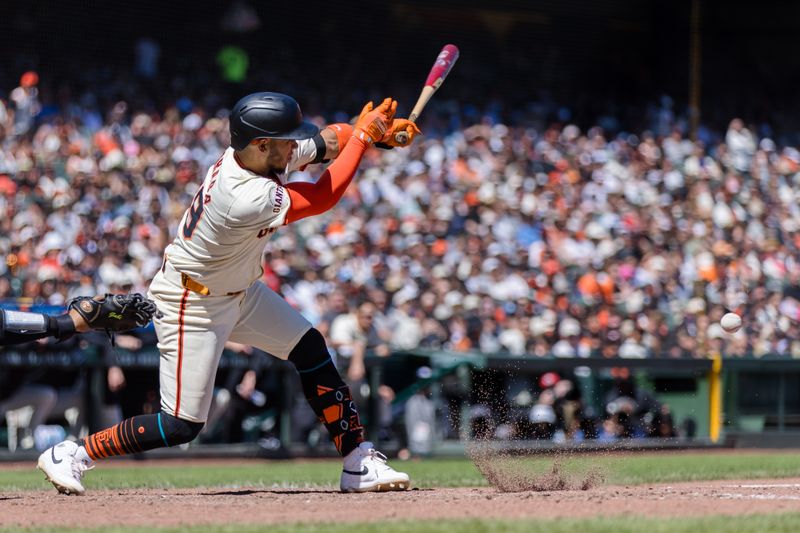 Apr 21, 2024; San Francisco, California, USA;  San Francisco Giants second baseman Thairo Estrada (39) hits a single against the Arizona Diamondbacks during the fifth inning at Oracle Park. Mandatory Credit: John Hefti-USA TODAY Sports