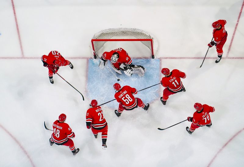 Jan 13, 2024; Raleigh, North Carolina, USA;  Carolina Hurricanes players warmups before the game against the Pittsburgh Penguins at PNC Arena. Mandatory Credit: James Guillory-USA TODAY Sports