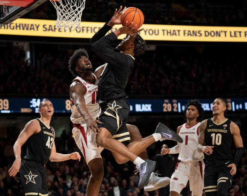 Jan 14, 2023; Nashville, Tennessee, USA;   
Vanderbilt Commodores guard Tyrin Lawrence (0) shoots the ball against Arkansas Razorbacks forward Jalen Graham (11) during the second half at Memorial Gymnasium. Mandatory Credit: George Walker IV - USA TODAY Sports