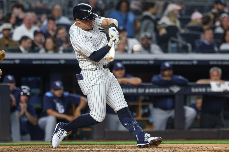 May 2, 2025; Bronx, New York, USA; New York Yankees shortstop Anthony Volpe (11) singles during the fourth inning against the Tampa Bay Rays at Yankee Stadium. Mandatory Credit: Vincent Carchietta-Imagn Images
