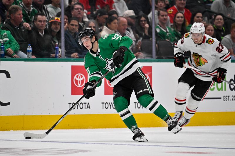 Oct 26, 2024; Dallas, Texas, USA; Dallas Stars center Wyatt Johnston (53) passes the puck during the second period against the Chicago Blackhawks at the American Airlines Center. Mandatory Credit: Jerome Miron-Imagn Images