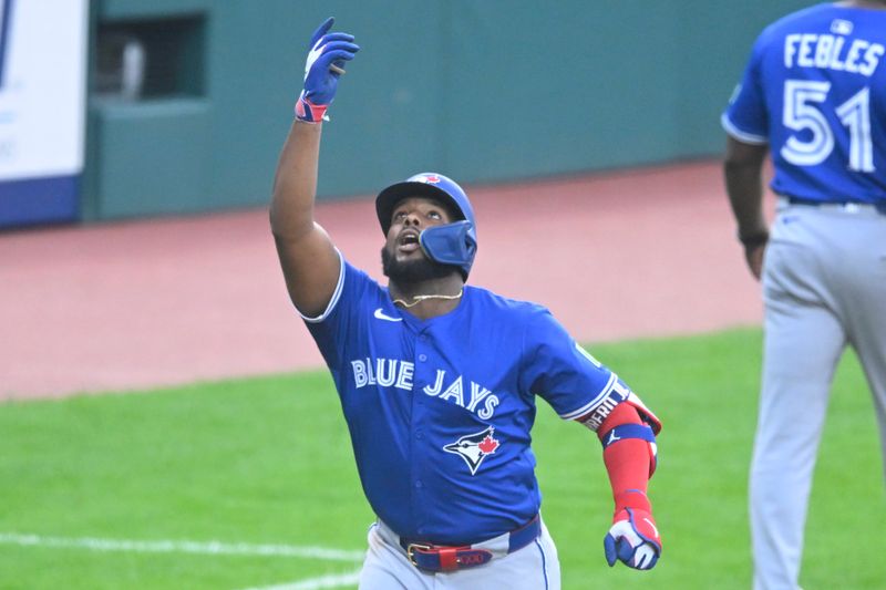 Jun 25, 2025; Cleveland, Ohio, USA; Toronto Blue Jays first baseman Vladimir Guerrero Jr. (27) celebrates his solo home run in the fourth inning against the Cleveland Guardians at Progressive Field. Mandatory Credit: David Richard-Imagn Images