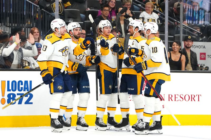 Feb 20, 2024; Las Vegas, Nevada, USA; Nashville Predators center Cody Glass (8) celebrates with team mates after scoring a goal against the Vegas Golden Knights during the first period at T-Mobile Arena. Mandatory Credit: Stephen R. Sylvanie-USA TODAY Sports