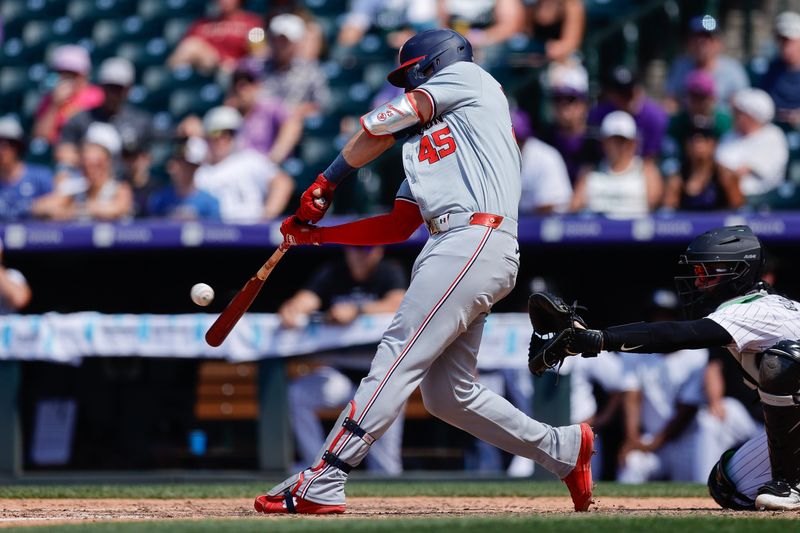 Jun 23, 2024; Denver, Colorado, USA; Washington Nationals first baseman Joey Meneses (45) hits an RBI single in the ninth inning against the Colorado Rockies at Coors Field. Mandatory Credit: Isaiah J. Downing-USA TODAY Sports