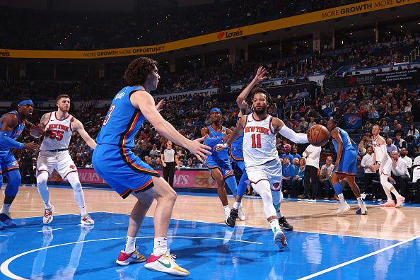 OKLAHOMA CITY, OK - DECEMBER 27: Jalen Brunson #11 of the New York Knicks looks to pass the ball during the game against the Oklahoma City Thunder on December 27, 2023 at Paycom Arena in Oklahoma City, Oklahoma. NOTE TO USER: User expressly acknowledges and agrees that, by downloading and or using this photograph, User is consenting to the terms and conditions of the Getty Images License Agreement. Mandatory Copyright Notice: Copyright 2023 NBAE (Photo by Zach Beeker/NBAE via Getty Images)