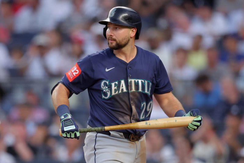 Jul 10, 2025; Bronx, New York, USA; Seattle Mariners catcher Cal Raleigh (29) reacts after striking out against the New York Yankees during the third inning at Yankee Stadium. Mandatory Credit: Brad Penner-Imagn Images