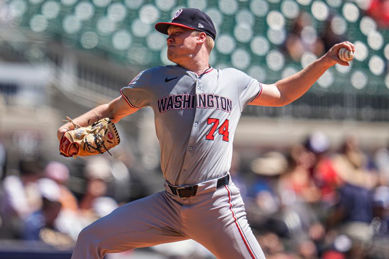 Aug 25, 2024; Cumberland, Georgia, USA; Washington Nationals starting pitcher DJ Herz (74) pitches against the Atlanta Braves during the third inning at Truist Park. Mandatory Credit: Dale Zanine-USA TODAY Sports