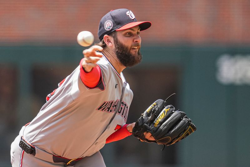 May 15, 2025; Cumberland, Georgia, USA; Washington Nationals pitcher Trevor Williams (32) pitches against the Atlanta Braves during the first inning at Truist Park. Mandatory Credit: Dale Zanine-Imagn Images