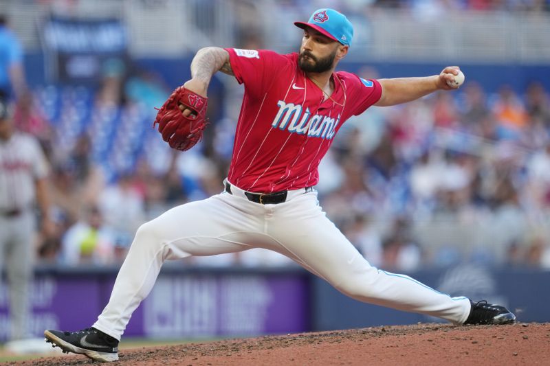 Apr 13, 2024; Miami, Florida, USA;  Miami Marlins pitcher Tanner Scott (66) pitches in the ninth inning against the Atlanta Braves at loanDepot Park. Mandatory Credit: Jim Rassol-USA TODAY Sports