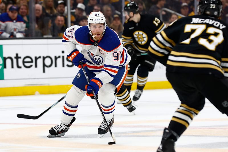 Mar 5, 2024; Boston, Massachusetts, USA; Edmonton Oilers center Connor McDavid (97) eyes Boston Bruins defenseman Charlie McAvoy (73) as he looks to get around him during the first period at TD Garden. Mandatory Credit: Winslow Townson-USA TODAY Sports