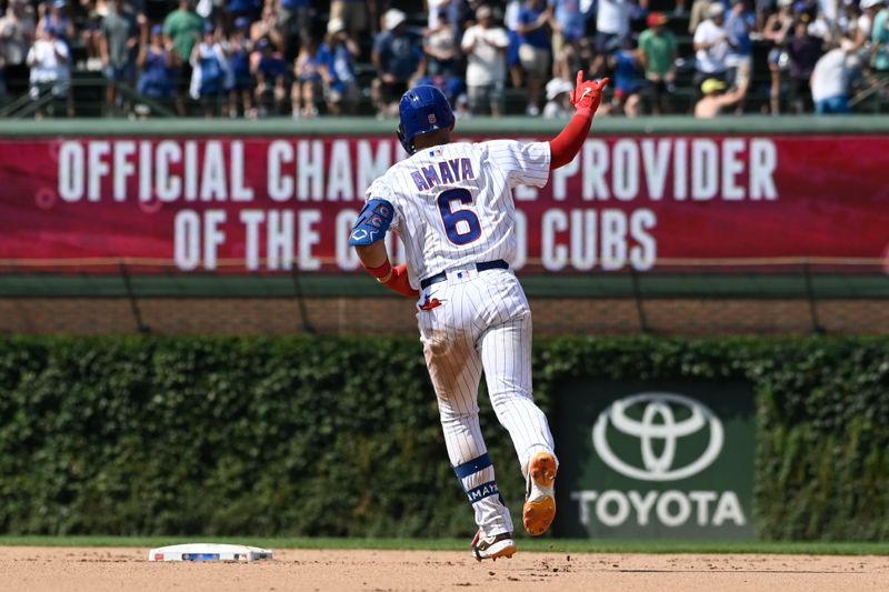 Aug 20, 2023; Chicago, Illinois, USA; Chicago Cubs catcher Miguel Amaya (6) points after hitting a home run against the Kansas City Royals during the eighth inning at Wrigley Field. Mandatory Credit: Matt Marton-USA TODAY Sports