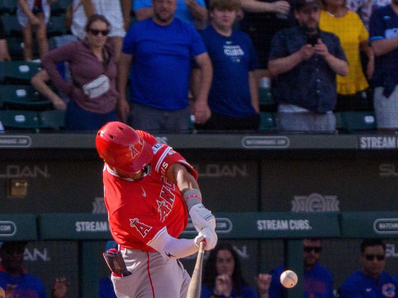 Feb 27, 2025; Mesa, Arizona, USA; Los Angeles Angels infielder Kyren Paris (19) hits a home run in the top of the ninth with two outs during a spring training game against the Chicago Cubs at Sloan Park to tie the game 4-4. Mandatory Credit: Allan Henry-Imagn Images