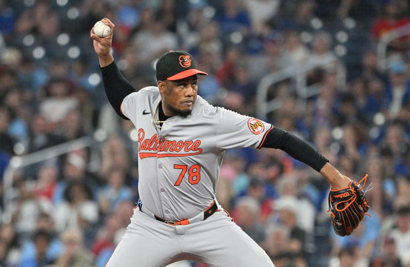 Jun 5, 2024; Toronto, Ontario, CAN;  Baltimore Orioles relief pitcher Yennier Cano (78) delivers a pitch against the Toronto Blue Jays in the eighth inning at Rogers Centre. Mandatory Credit: Dan Hamilton-USA TODAY Sports 