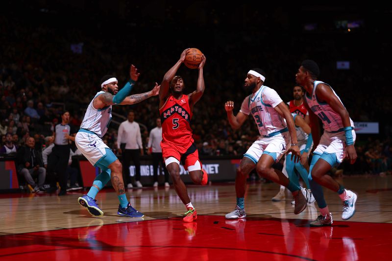 TORONTO, CANADA - MARCH 3: Immanuel Quickley #5 of the Toronto Raptors drives to the basket during the game against the Charlotte Hornets on March 3, 2024 at the Scotiabank Arena in Toronto, Ontario, Canada.  NOTE TO USER: User expressly acknowledges and agrees that, by downloading and or using this Photograph, user is consenting to the terms and conditions of the Getty Images License Agreement.  Mandatory Copyright Notice: Copyright 2024 NBAE (Photo by Vaughn Ridley/NBAE via Getty Images)