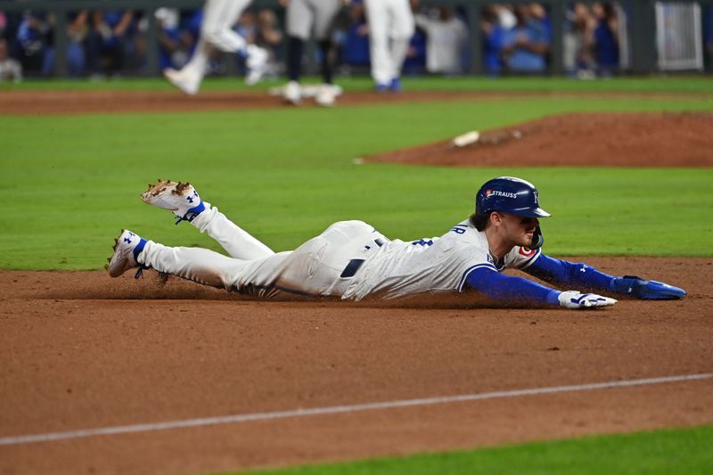 Oct 9, 2024; Kansas City, Missouri, USA; Kansas City Royals shortstop Bobby Witt Jr. (7) dices to third base in the eighth inning against the New York Yankees during game three of the NLDS for the 2024 MLB Playoffs at Kauffman Stadium. Mandatory Credit: Peter Aiken-Imagn Images