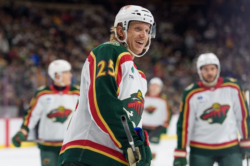 Nov 4, 2025; Saint Paul, Minnesota, USA; Minnesota Wild defenseman Jonas Brodin (25) smiles during a break in the action against the Nashville Predators in the first period at Grand Casino Arena. Mandatory Credit: Matt Blewett-Imagn Images