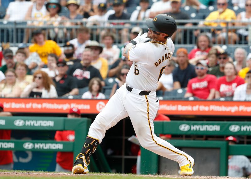 Aug 25, 2024; Pittsburgh, Pennsylvania, USA;  Pittsburgh Pirates catcher Yasmani Grandal (6) hits a game winning walk-off two run home run against the Cincinnati Reds during the ninth inning at PNC Park. Mandatory Credit: Charles LeClaire-USA TODAY Sports