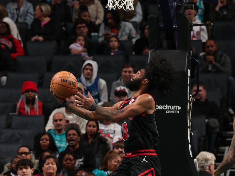 CHARLOTTE, NC - JANUARY 31: Coby White #0 of the Chicago Bulls shoots the ball during the game against the Charlotte Hornets on January 31, 2024 at Spectrum Center in Charlotte, North Carolina. NOTE TO USER: User expressly acknowledges and agrees that, by downloading and or using this photograph, User is consenting to the terms and conditions of the Getty Images License Agreement. Mandatory Copyright Notice: Copyright 2024 NBAE (Photo by Kent Smith/NBAE via Getty Images)