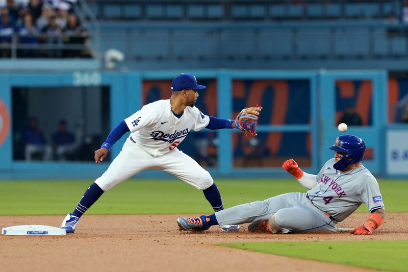 Apr 19, 2024; Los Angeles, California, USA;  New York Mets catcher Francisco Alvarez (4) is safe at second ahead of a throw to Los Angeles Dodgers shortstop Mookie Betts (50) during the second inning at Dodger Stadium. Mandatory Credit: Kiyoshi Mio-USA TODAY Sports