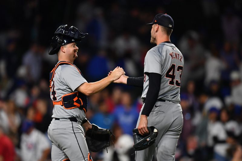 Aug 21, 2024; Chicago, Illinois, USA; Detroit Tigers catcher Jake Rogers (left) and relief pitcher Joey Wentz (43) celebrate after defeating the Chicago Cubs at Wrigley Field. Mandatory Credit: Patrick Gorski-USA TODAY Sports