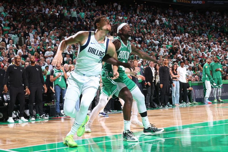 BOSTON, MA - JUNE 17: Dwight Powell #7 of the Dallas Mavericks boxes out Jrue Holiday #4 of the Boston Celtics during the game during Game 5 of the 2024 NBA Finals on June 17, 2024 at the TD Garden in Boston, Massachusetts. NOTE TO USER: User expressly acknowledges and agrees that, by downloading and or using this photograph, User is consenting to the terms and conditions of the Getty Images License Agreement. Mandatory Copyright Notice: Copyright 2024 NBAE  (Photo by Nathaniel S. Butler/NBAE via Getty Images)