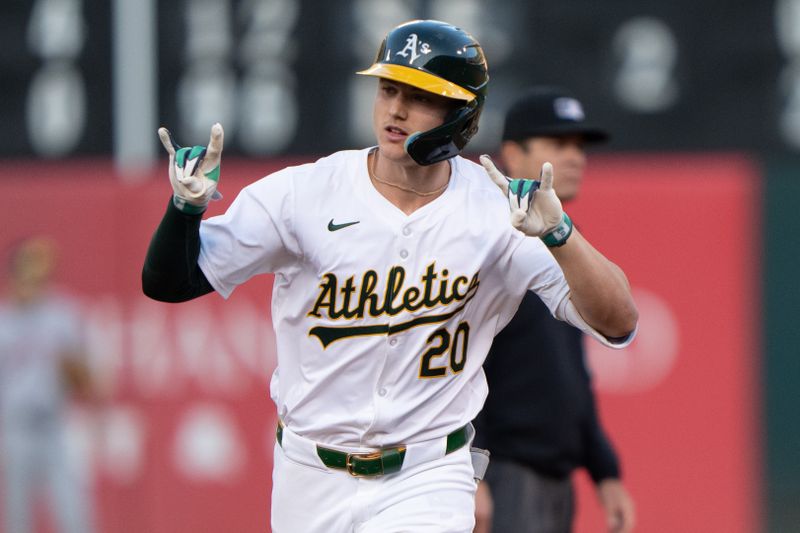 Jul 23, 2024; Oakland, California, USA;  Oakland Athletics second base Zack Gelof (20) reacts to the bullpen after hitting a solo home run during the fourth inning against the Houston Astros at Oakland-Alameda County Coliseum. Mandatory Credit: Stan Szeto-USA TODAY Sports