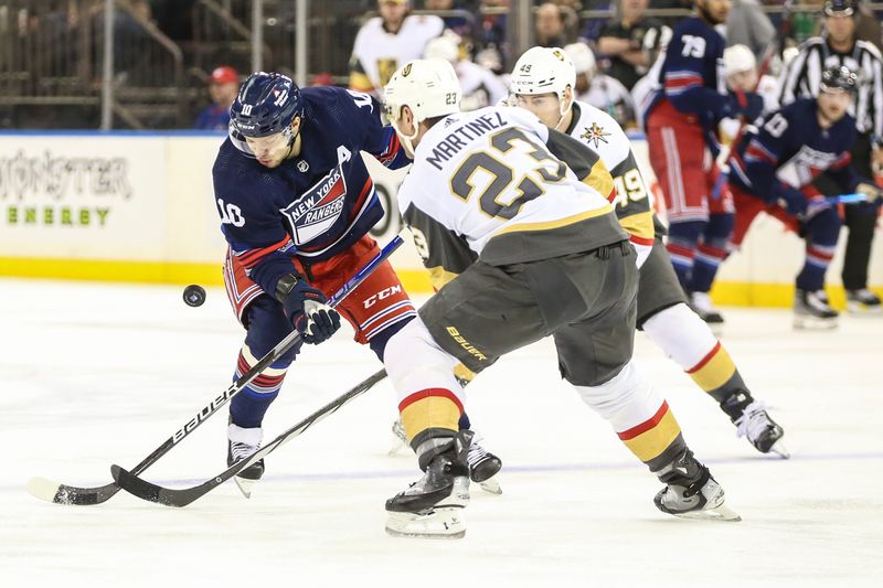 Jan 26, 2024; New York, New York, USA; New York Rangers left wing Artemi Panarin (10) and Vegas Golden Knights defenseman Alec Martinez (23) battle for control of the puck in the second period at Madison Square Garden. Mandatory Credit: Wendell Cruz-USA TODAY Sports