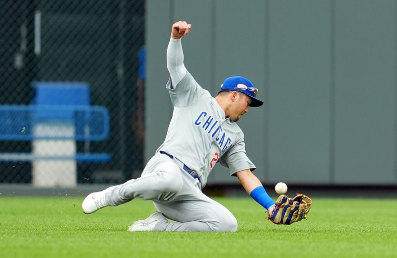 Jul 28, 2024; Kansas City, Missouri, USA; Chicago Cubs right fielder Seiya Suzuki (27) is unable to make the catch during the second inning against the Kansas City Royals at Kauffman Stadium. Mandatory Credit: Jay Biggerstaff-USA TODAY Sports