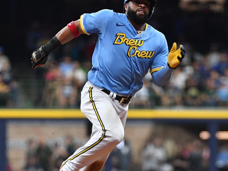 Aug 25, 2023; Milwaukee, Wisconsin, USA; Milwaukee Brewers first baseman Carlos Santana (41) rounds second bases and reaches third base against the San Diego Padres in the seventh inning at American Family Field. Mandatory Credit: Michael McLoone-USA TODAY Sports