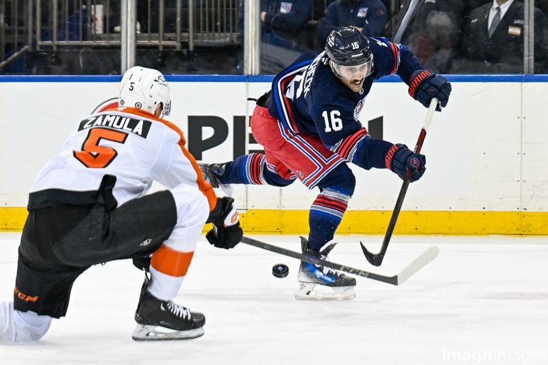 Apr 9, 2025; New York, New York, USA;  Philadelphia Flyers defenseman Egor Zamula (5) blocks a shot by New York Rangers center Vincent Trocheck (16) during the second period at Madison Square Garden. Mandatory Credit: Dennis Schneidler-Imagn Images