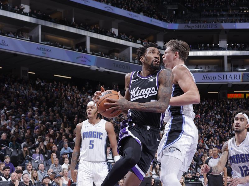 SACRAMENTO, CA - JANUARY 3: Malik Monk #0 of the Sacramento Kings drives to the basket during the game against the Orlando Magic on January 3, 2024 at Golden 1 Center in Sacramento, California. NOTE TO USER: User expressly acknowledges and agrees that, by downloading and or using this Photograph, user is consenting to the terms and conditions of the Getty Images License Agreement. Mandatory Copyright Notice: Copyright 2024 NBAE (Photo by Rocky Widner/NBAE via Getty Images)