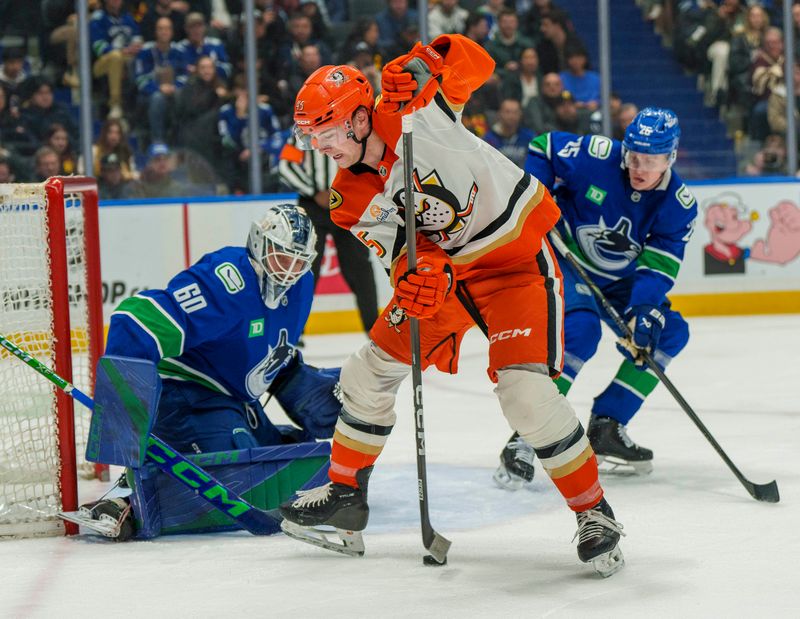 Jan 29, 2026; Vancouver, British Columbia, CAN;  Anaheim Ducks Right Wing Beckett Sennecke (45) plays the puck between his legs in front of Vancouver goaltender Nikita Tolopilo (60) in the second period at Rogers Arena. Mandatory Credit: Christopher Morris-Imagn Images
