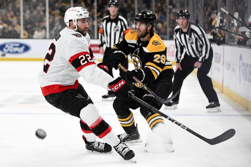 Jan 23, 2025; Boston, Massachusetts, USA; Boston Bruins defenseman Parker Wotherspoon (29) passes the puck past Ottawa Senators right wing Michael Amadio (22) during the first period at the TD Garden. Mandatory Credit: Brian Fluharty-Imagn Images