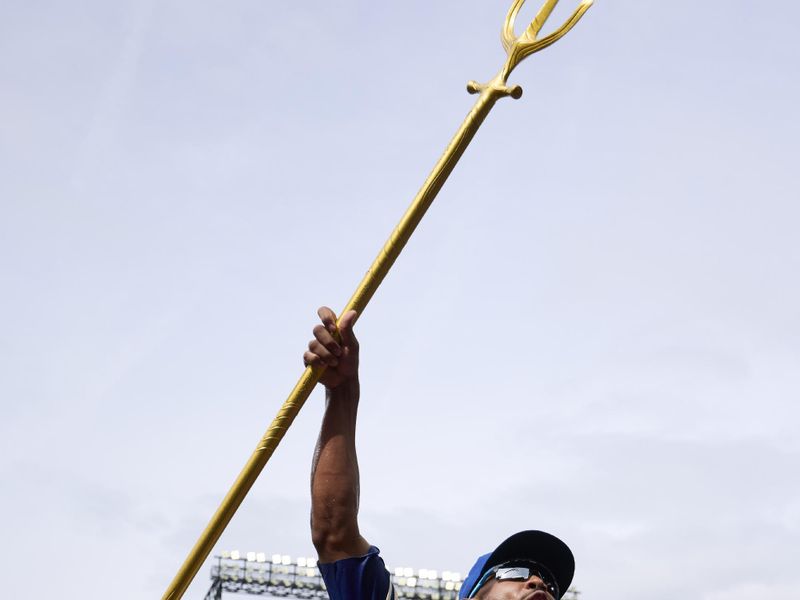 Aug 3, 2025; Seattle, Washington, USA; Seattle Mariners center fielder Julio Rodríguez (44) celebrates with the trident after playing the Texas Rangers at T-Mobile Park. Mandatory Credit: John Froschauer-Imagn Images