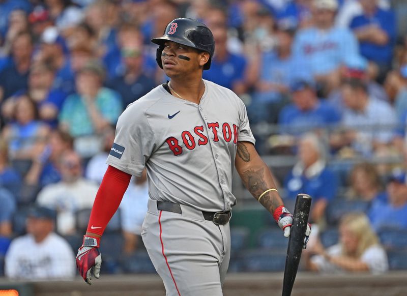 Aug 5, 2024; Kansas City, Missouri, USA;  Boston Red Sox third baseman Rafael Devers (11) walks back to the dugout after striking out in the first inning against the Kansas City Royals at Kauffman Stadium. Mandatory Credit: Peter Aiken-USA TODAY Sports