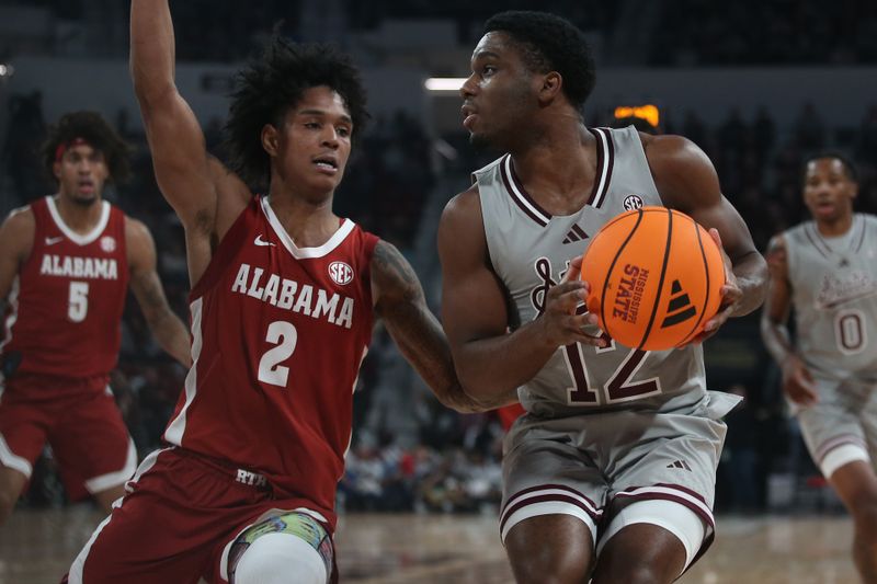 Jan 13, 2026; Starkville, Mississippi, USA; Mississippi State Bulldogs guard Josh Hubbard (12) handles the ball as Alabama Crimson Tide guard Aden Holloway (2) defends during the first half at Humphrey Coliseum. Mandatory Credit: Petre Thomas-Imagn Images