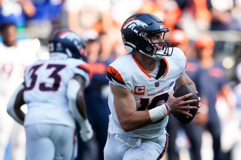 Denver Broncos quarterback Bo Nix (10) looks to throw during the second half of an NFL football game against the Seattle Seahawks, Sunday, Sept. 8, 2024, in Seattle. (AP Photo/Lindsey Wasson)