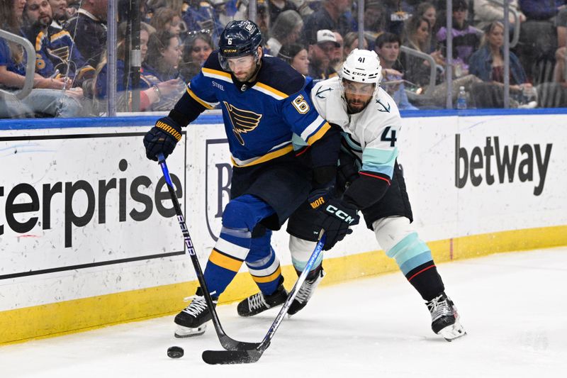 Apr 14, 2024; St. Louis, Missouri, USA; Seattle Kraken defenseman Justin Schultz (4) pressures St. Louis Blues defenseman Marco Scandella (6) during the third period at Enterprise Center. Mandatory Credit: Jeff Le-USA TODAY Sports