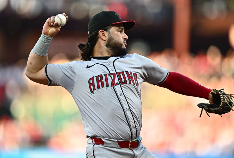 Jun 21, 2024; Philadelphia, Pennsylvania, USA; Arizona Diamondbacks third baseman Eugenio Suarez (28) throws to first against the Philadelphia Phillies in the second inning at Citizens Bank Park. Mandatory Credit: Kyle Ross-USA TODAY Sports