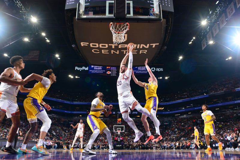 PHOENIX, AZ - OCTOBER 17: Jusuf Nurkic #20 of the Phoenix Suns grabs the rebound during the game against the Los Angeles Lakers on October 17, 2024 at Footprint Center in Phoenix, Arizona. NOTE TO USER: User expressly acknowledges and agrees that, by downloading and or using this photograph, user is consenting to the terms and conditions of the Getty Images License Agreement. Mandatory Copyright Notice: Copyright 2024 NBAE (Photo by Kate Frese/NBAE via Getty Images)