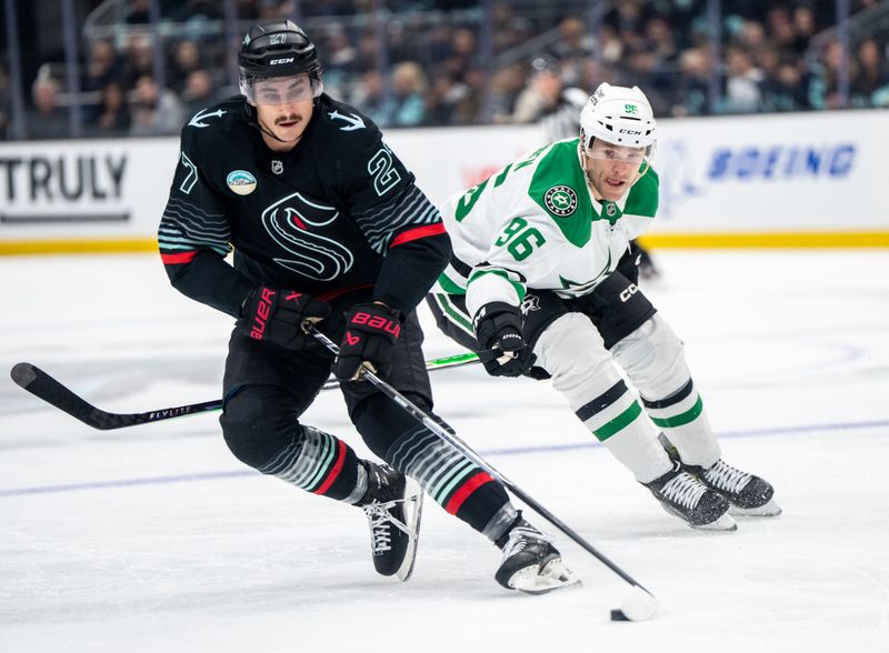 Nov 26, 2025; Seattle, Washington, USA; Seattle Kraken forward Mason Marchment (27) skates agianst Dallas Stars forward Mikko Rantanen (96) during the first period at Climate Pledge Arena. Mandatory Credit: Stephen Brashear-Imagn Images