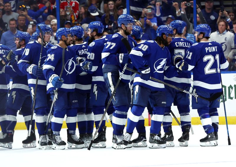 Apr 27, 2024; Tampa, Florida, USA; Tampa Bay Lightning left wing Anthony Duclair (10), defenseman Victor Hedman (77), center Brayden Point (21) and teammates  celebrate after they beat the Florida Panthers in game four of the first round of the 2024 Stanley Cup Playoffs at Amalie Arena. Mandatory Credit: Kim Klement Neitzel-USA TODAY Sports